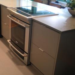 grey all aluminum cabinets with slide-in stove Victoria BC
