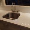 bone white aluminium galley kitchen white quartz with undermount sink