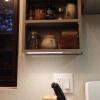 Custom spice rack with under cabinet lighting next to stove