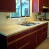 before photo of burgundy 80s style kitchen
